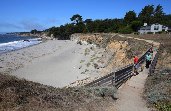 Tom Aswad, left, followed by Cindy Rubin, Donna Aswad and Jeff Rubin, walk along the newly re-opened trail with access to Walk-On Beach in the Sea Ranch on Friday, August 22. 2014 (Christopher Chung/ The Press Democrat)